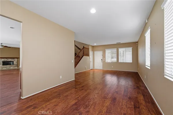 a kitchen with stainless steel appliances kitchen island granite countertop a stove a sink and a refrigerator