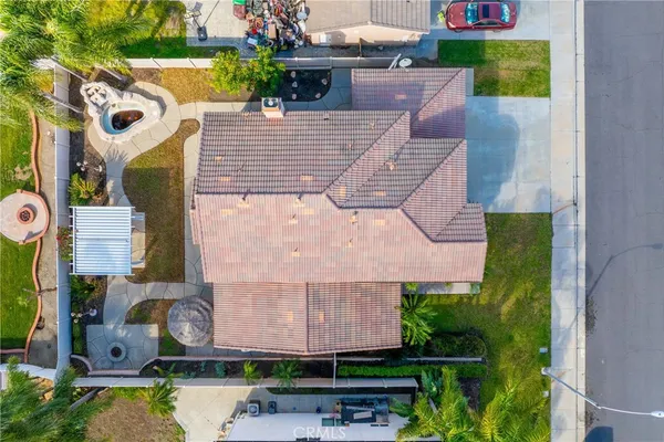 a aerial view of a house with garden space and sitting area