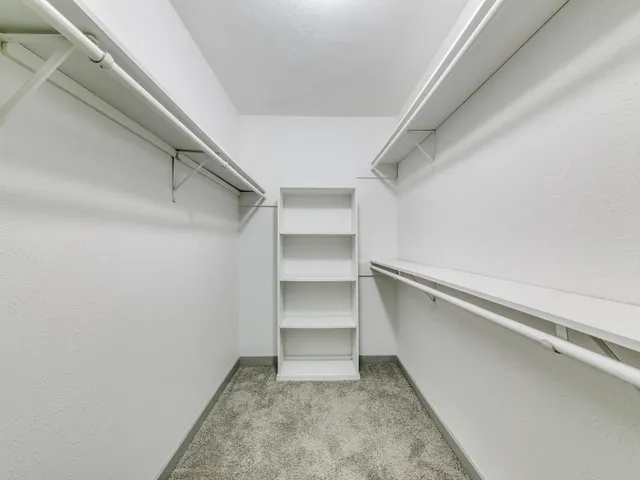 a view of an empty walk in closet