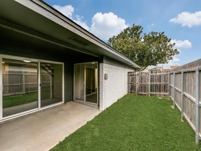 a view of backyard with green space