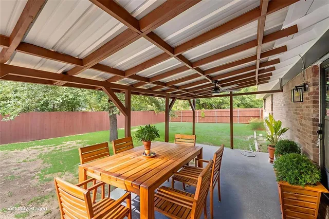 a view of yard with patio