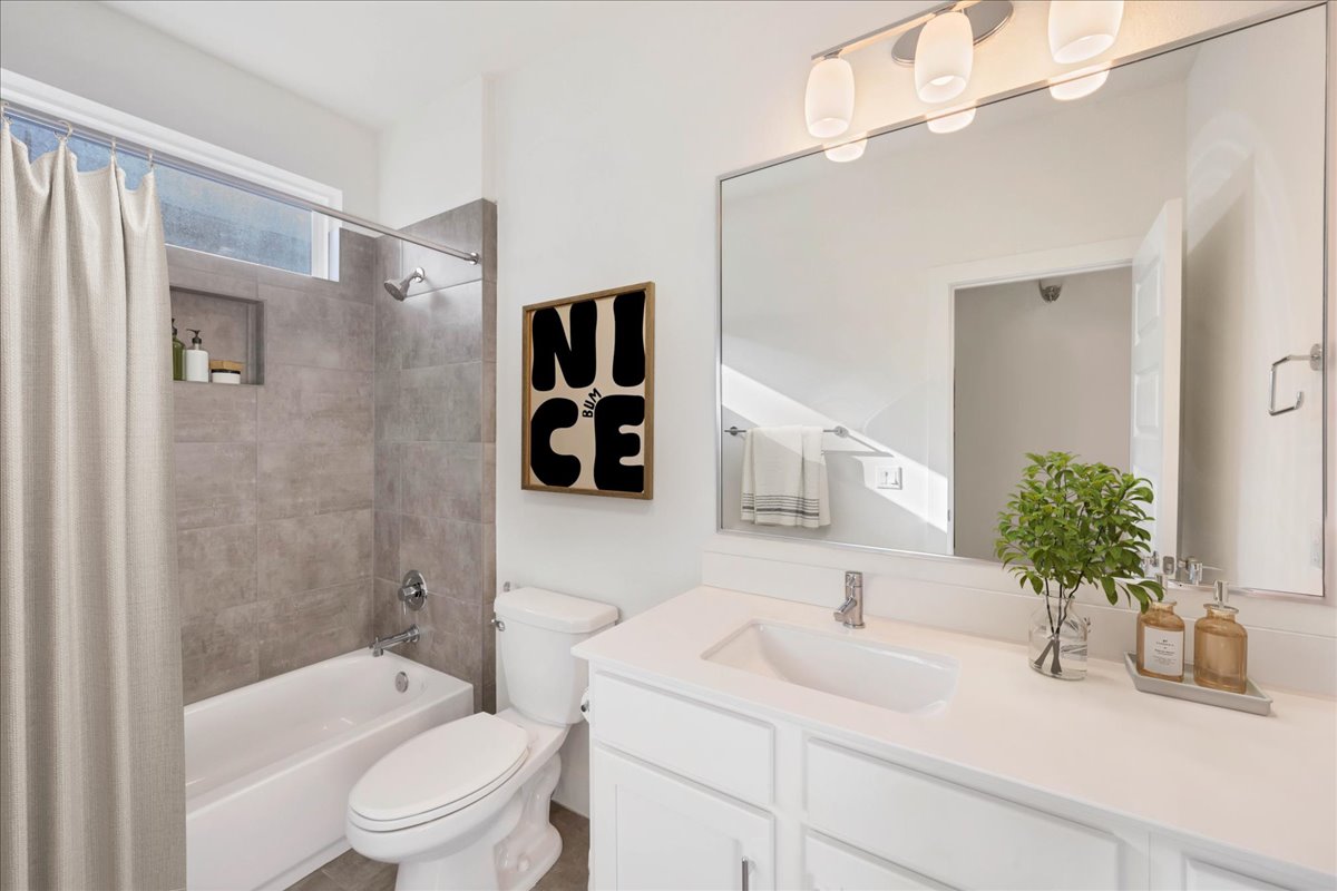 8922 Manchaca Road, Unit 906 Austin, TX 78748 - Photo 7 of 29 a bathroom with a sink a toilet a tub and shower