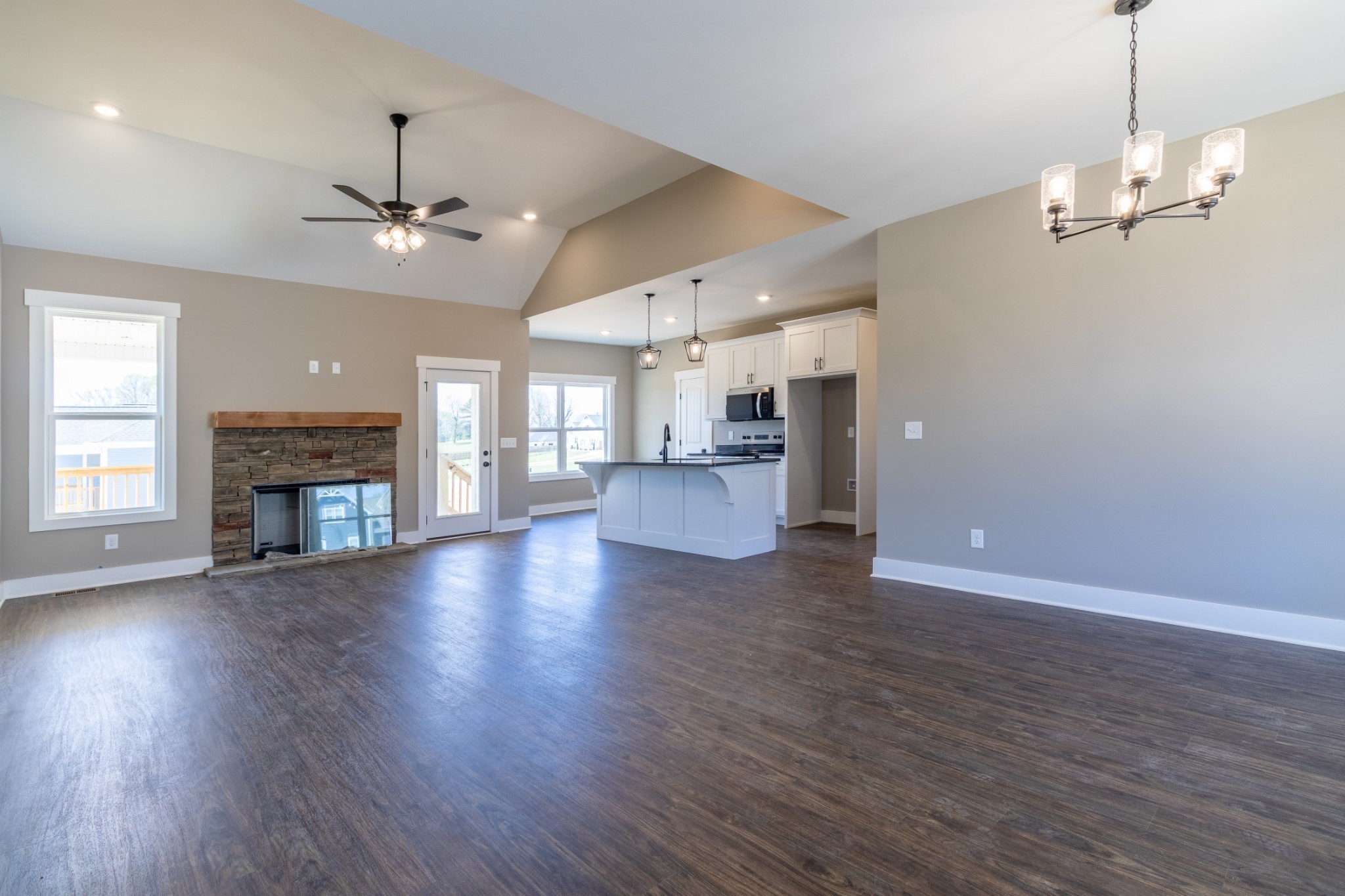 1137 Goose Drive Springfield, TN 37172 - Photo 27 of 28 an empty room with wooden floor fireplace and windows
