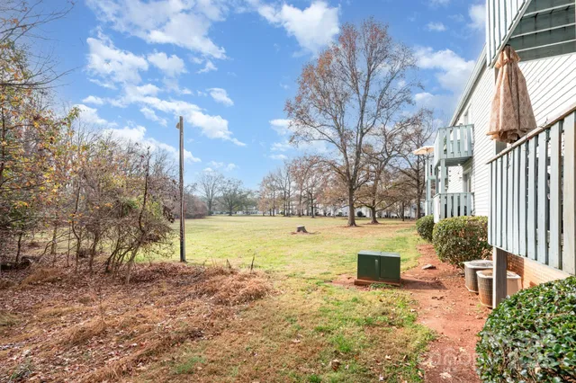 a view of a yard with swimming pool