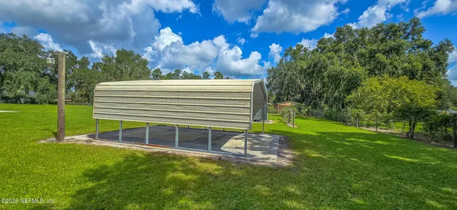 a view of a backyard with a small garden
