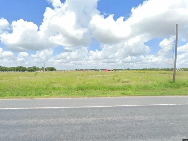 a view of a lake with a big yard