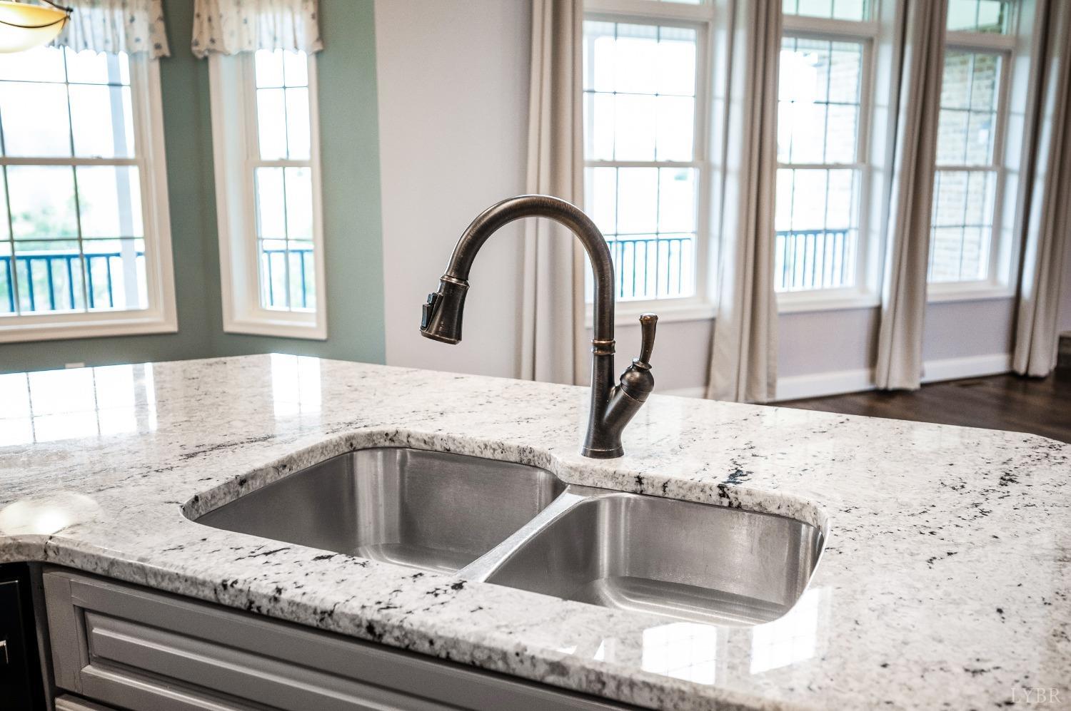 1695 Colby Drive Forest, VA 24551 - Photo 14 of 92 a kitchen with a granite countertop sink and a window