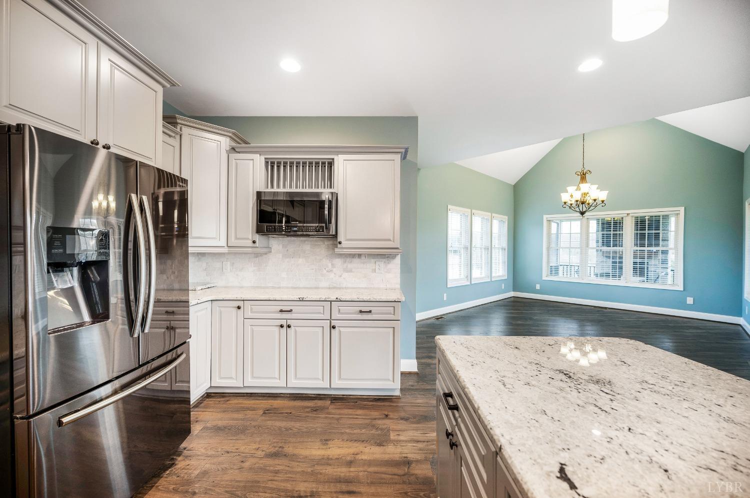 1695 Colby Drive Forest, VA 24551 - Photo 15 of 92 a modern kitchen with stainless steel appliances granite countertop a refrigerator and a sink