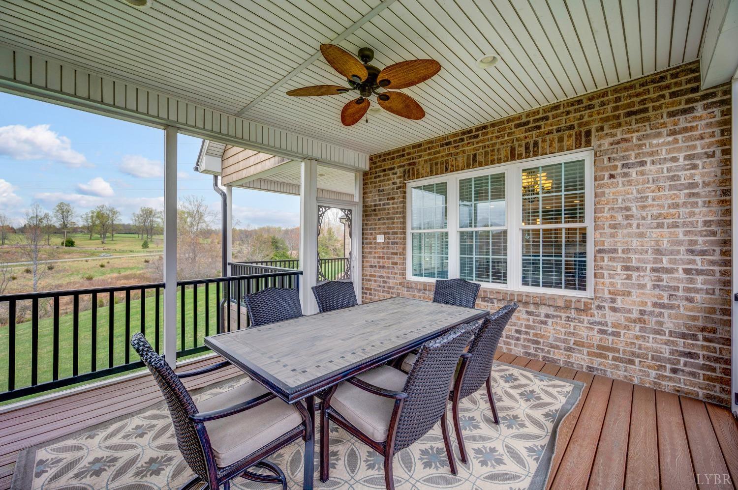 1695 Colby Drive Forest, VA 24551 - Photo 28 of 92 a view of a patio with a table chairs and a backyard