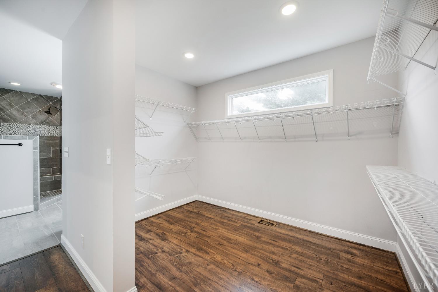 1695 Colby Drive Forest, VA 24551 - Photo 43 of 92 a view of empty room with wooden floor and fan