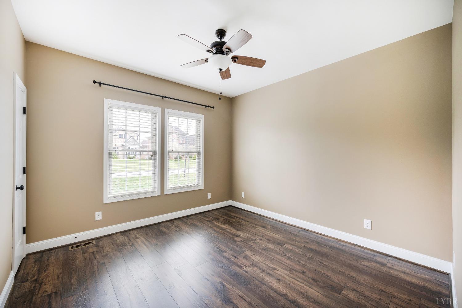 1695 Colby Drive Forest, VA 24551 - Photo 46 of 92 an empty room with wooden floor and windows