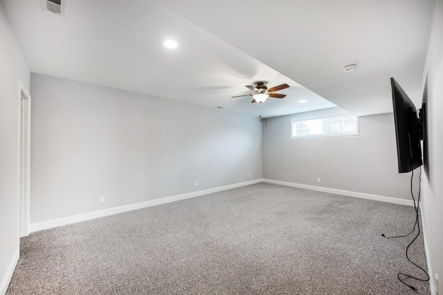 1695 Colby Drive Forest, VA 24551 - Photo 70 of 92 a view of empty room with a flat screen tv