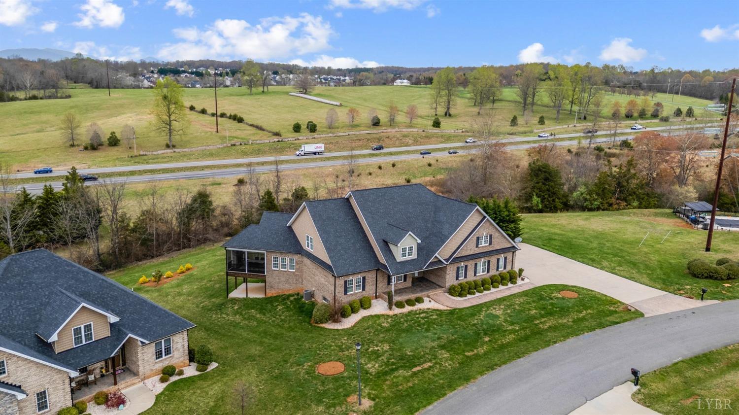 1695 Colby Drive Forest, VA 24551 - Photo 88 of 92 an aerial view of a house with outdoor space swimming pool and lake view