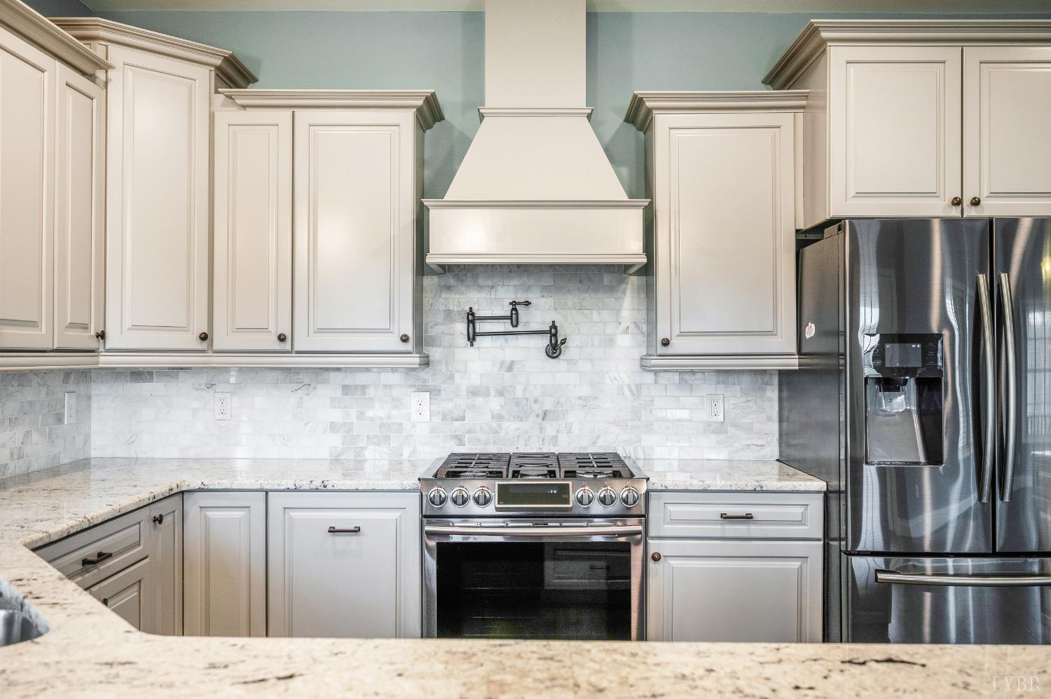 1695 Colby Drive Forest, VA 24551 - Photo 10 of 92 a kitchen with stainless steel appliances granite countertop a refrigerator sink and stove