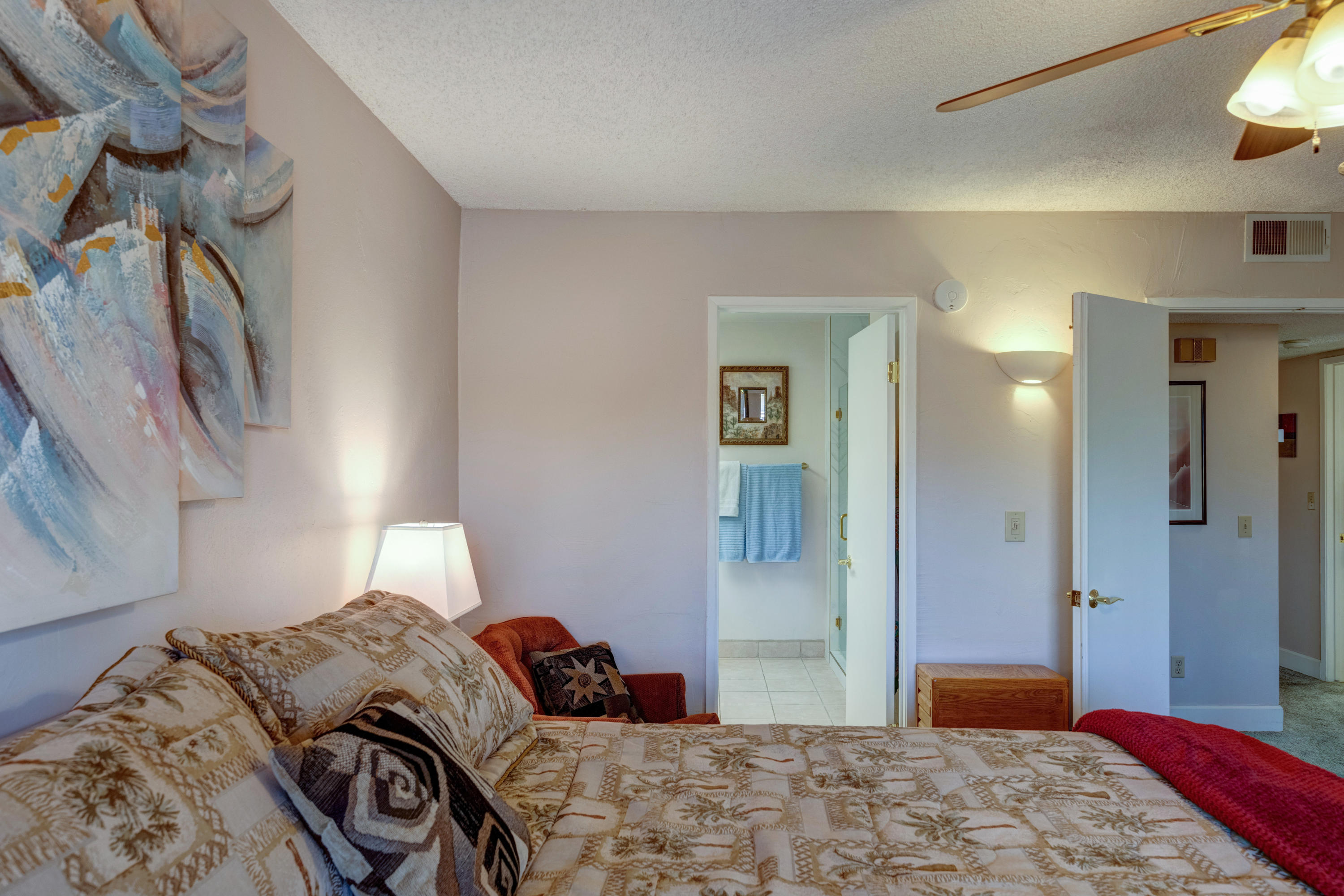 3155 Ramon Road, Unit 503 Palm Springs, CA 92264 - Photo 11 of 21 a bedroom with a bed and a chandelier