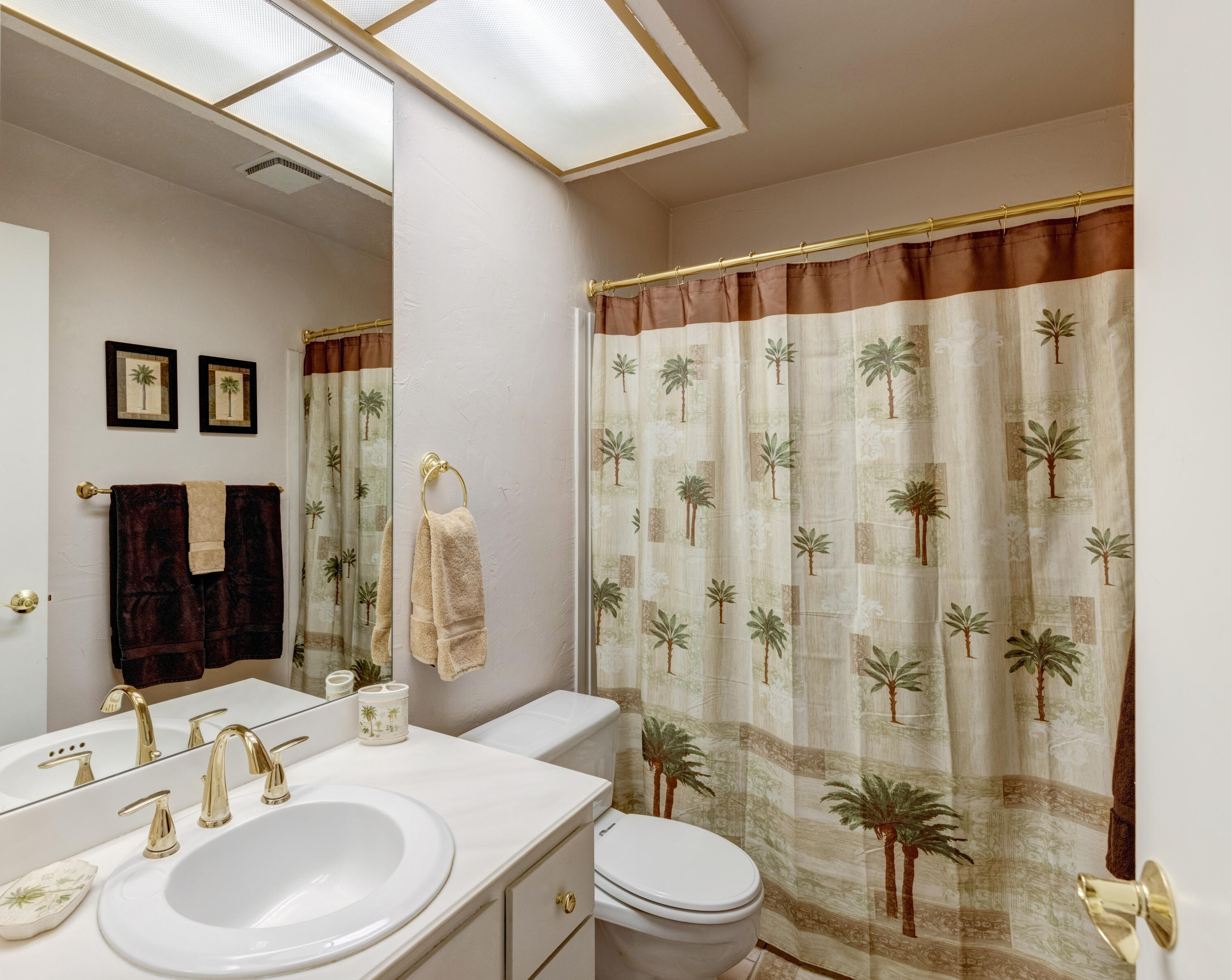 3155 Ramon Road, Unit 503 Palm Springs, CA 92264 - Photo 16 of 21 a bathroom with a sink a toilet and shower
