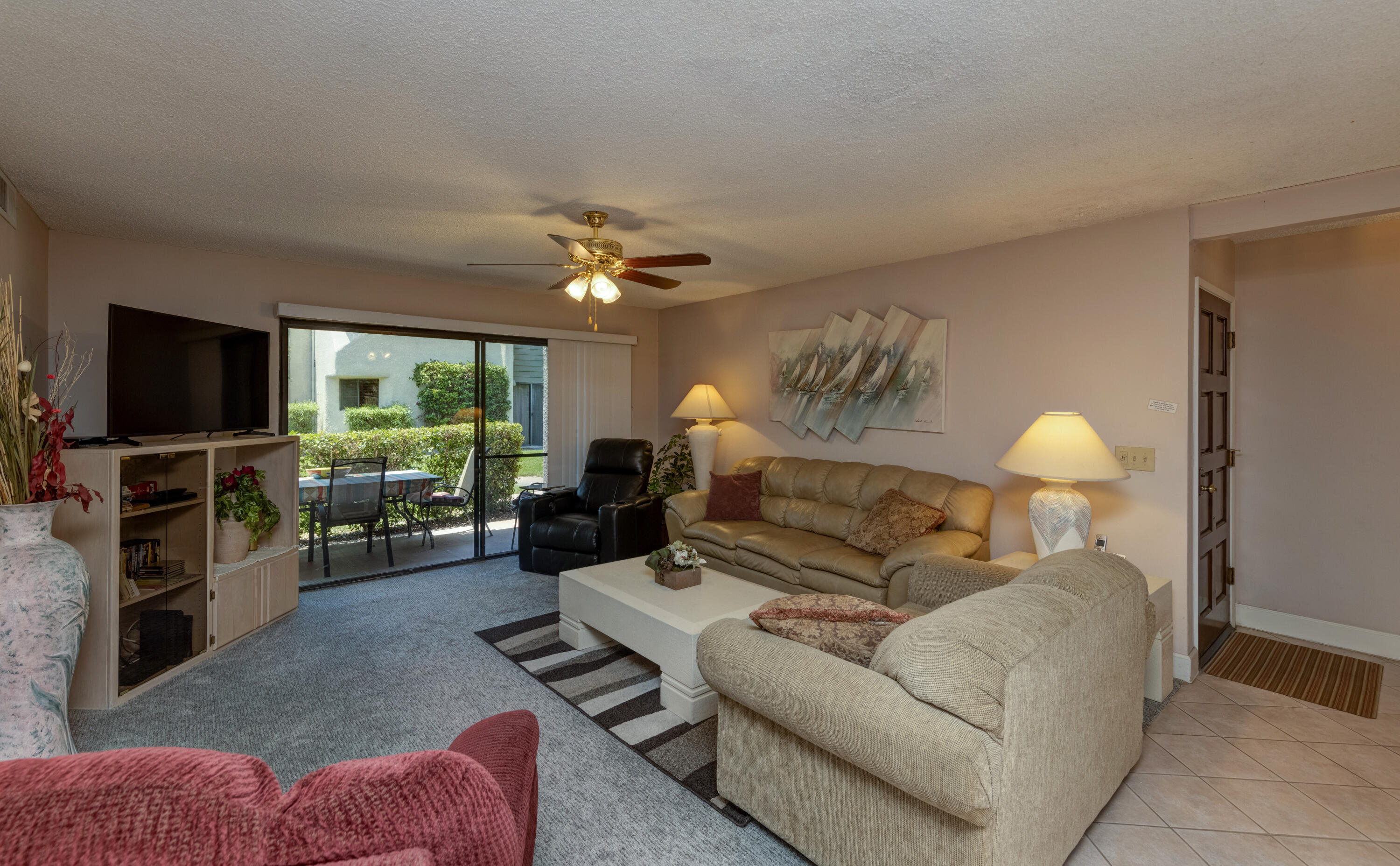 3155 Ramon Road, Unit 503 Palm Springs, CA 92264 - Photo 3 of 21 a living room with furniture and a flat screen tv