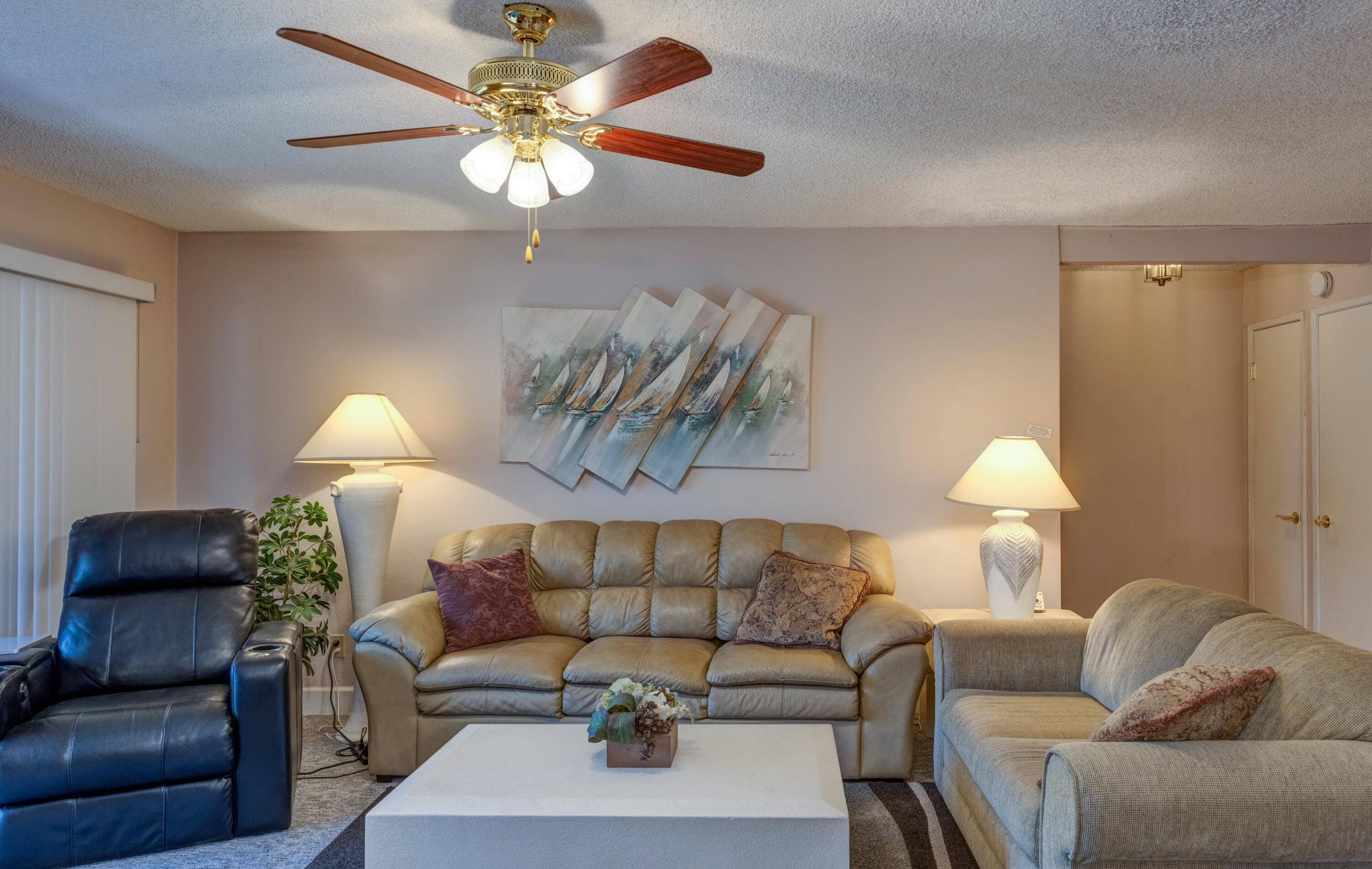 3155 Ramon Road, Unit 503 Palm Springs, CA 92264 - Photo 4 of 21 a living room with furniture and a lamp