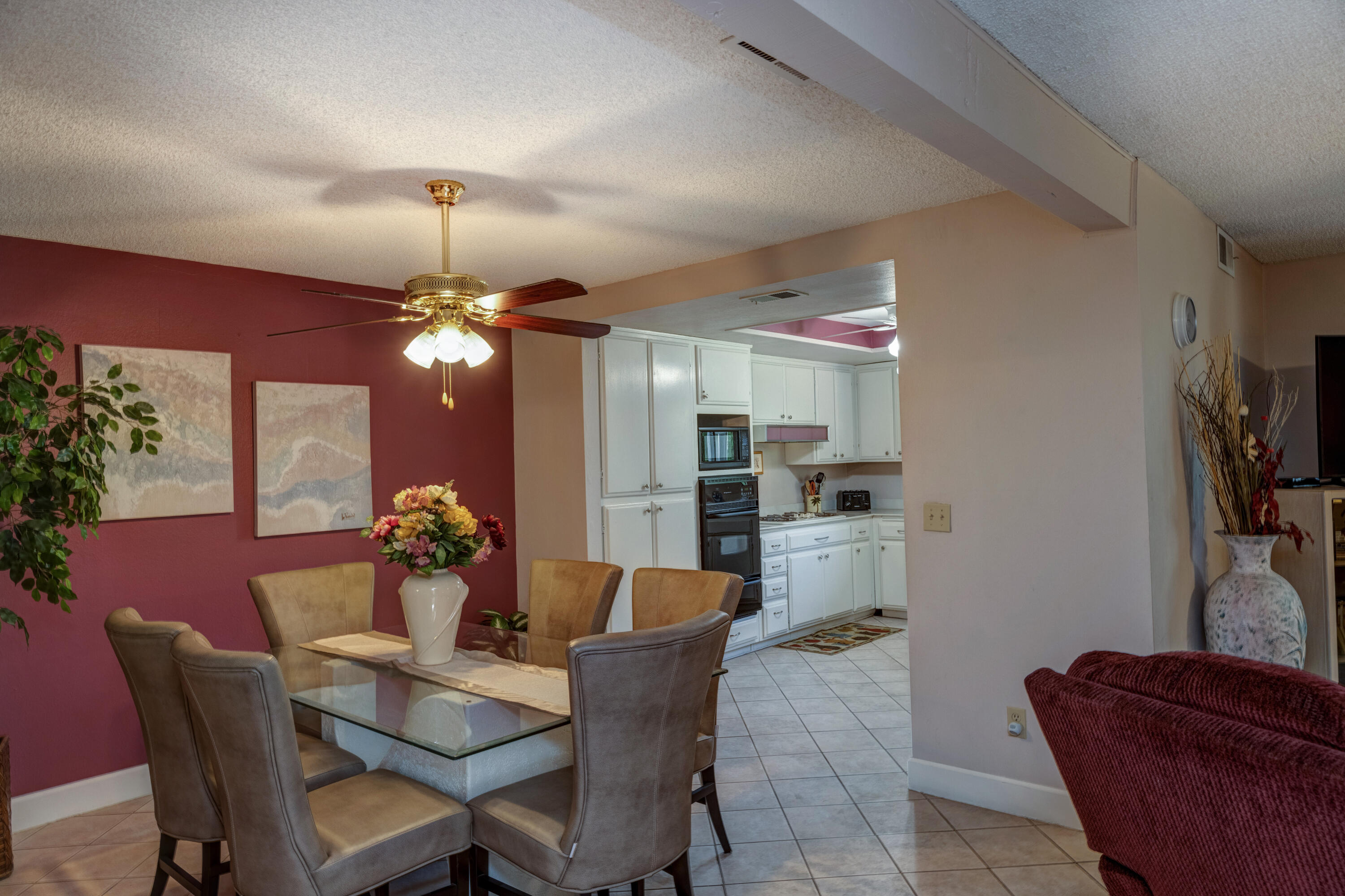 3155 Ramon Road, Unit 503 Palm Springs, CA 92264 - Photo 5 of 21 a view of a dining room with furniture and chandelier