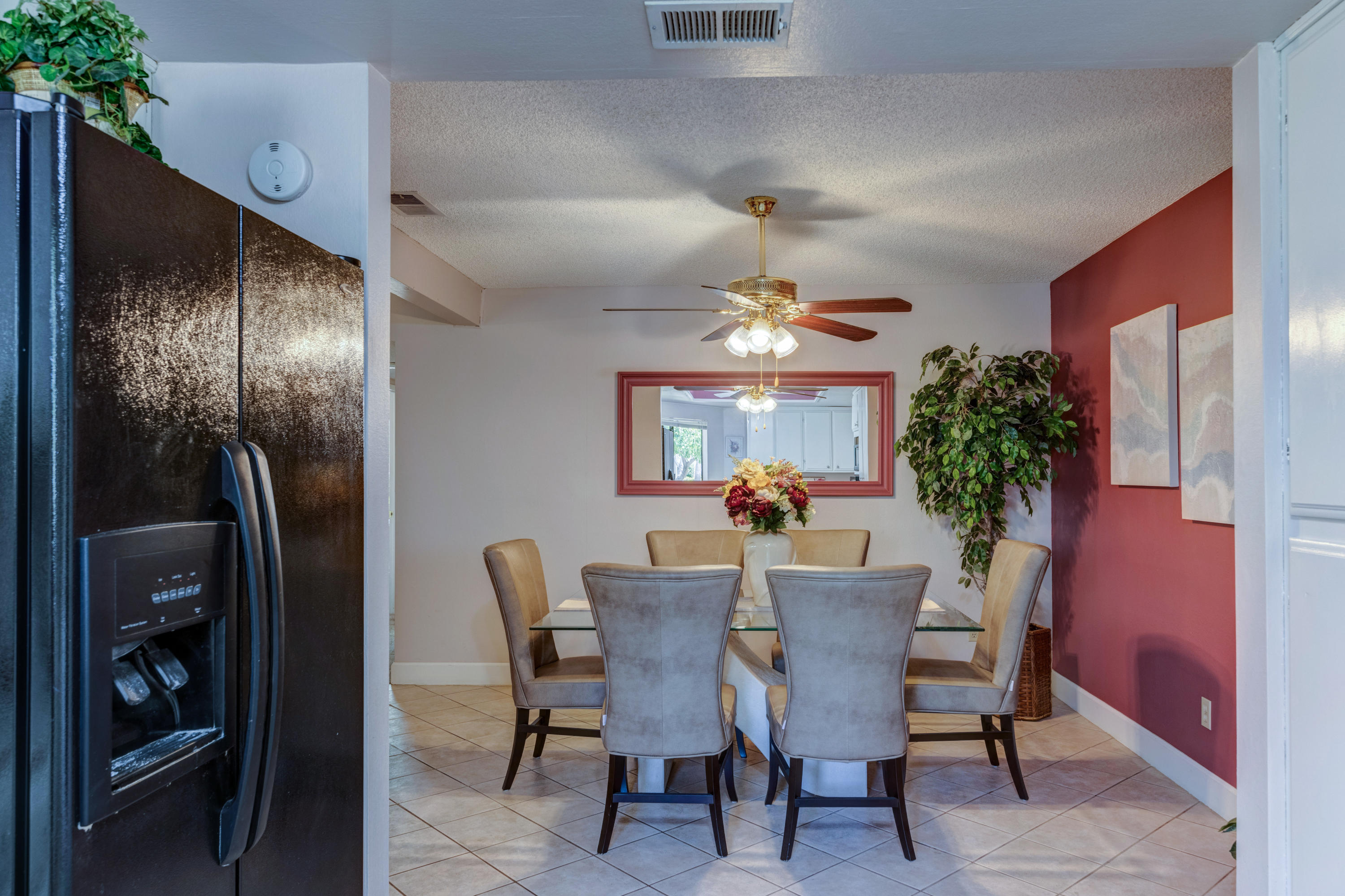 3155 Ramon Road, Unit 503 Palm Springs, CA 92264 - Photo 8 of 21 a view of a dining room with furniture and chandelier