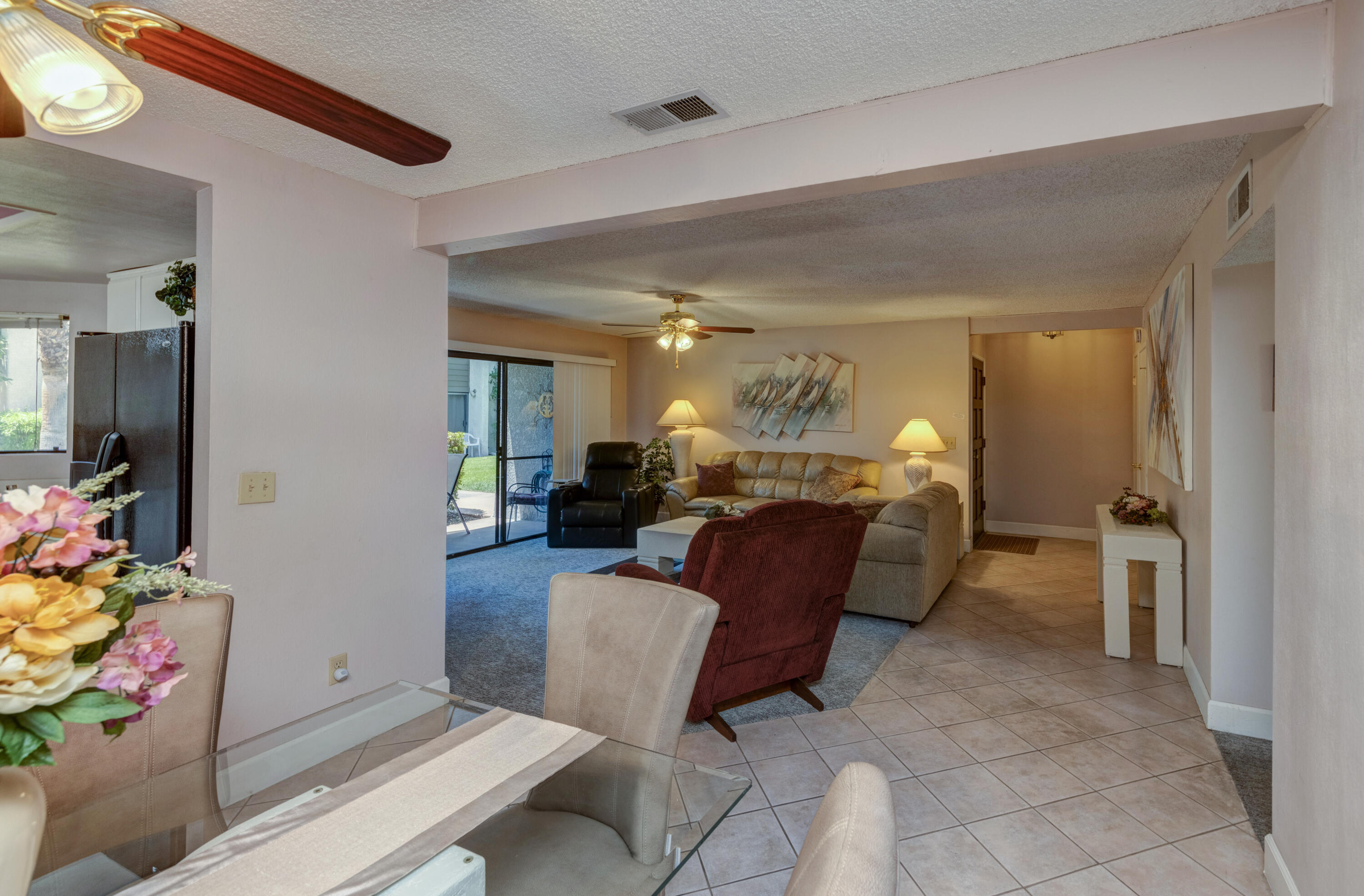 3155 Ramon Road, Unit 503 Palm Springs, CA 92264 - Photo 9 of 21 a living room with furniture and a dining table