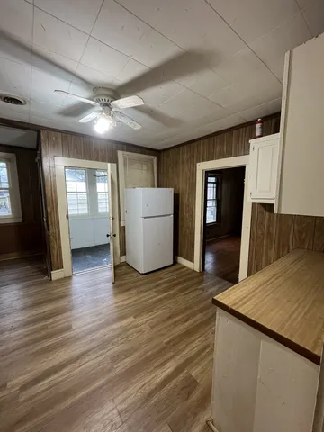 a view of a kitchen cabinets and a wooden floor