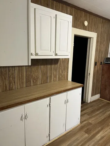a kitchen with white cabinets