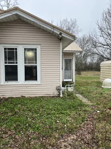 a house view with a garden space