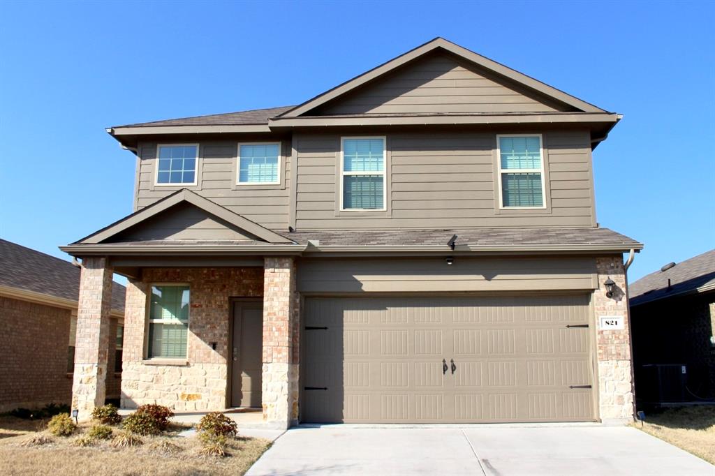 821 Country Road Royse City, TX 75189 - Photo 1 of 15 a front view of a house with a yard