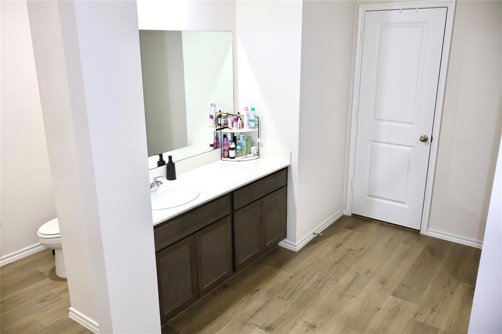 821 Country Road Royse City, TX 75189 - Photo 9 of 15 a bathroom with a sink and a mirror