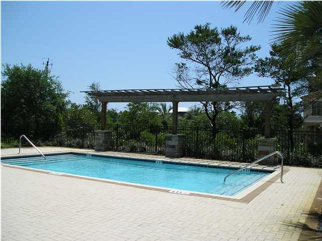 a view of a swimming pool with an outdoor space and seating area
