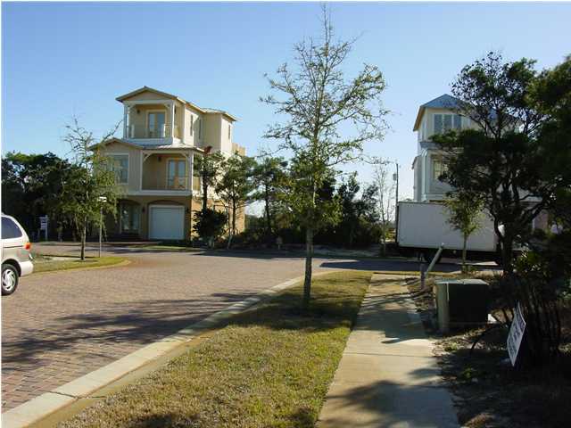 Lot 7 Pompano Pl Inlet Beach Inlet Beach, FL 32461 - Photo 3 of 7 a front view of a house with a yard garage and sitting area