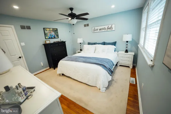 a bedroom with furniture and a window