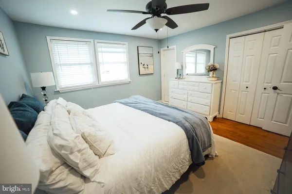 a bedroom with a bed and wall painting