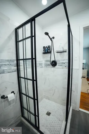 a bedroom with a bed and a desk