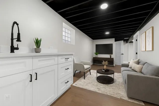 a living room with furniture and flat screen tv