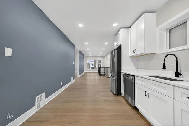 a view of a kitchen with a sink