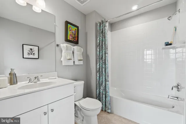 a bathroom with a sink a toilet and a bathtub