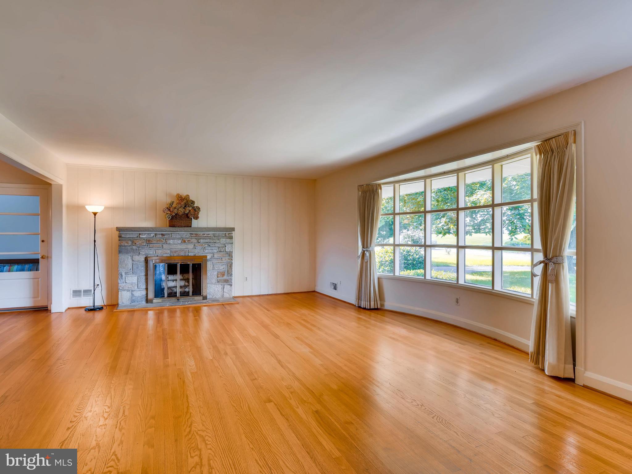 327 East Timonium Road Lutherville-Timonium, MD 21093 - Photo 7 of 30 Living Room with Stone Wood Burning Fireplace