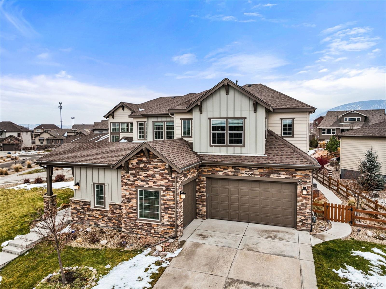 9459 Gore Loop Arvada, CO 80007 - Photo 2 of 50 a front view of a house with yard