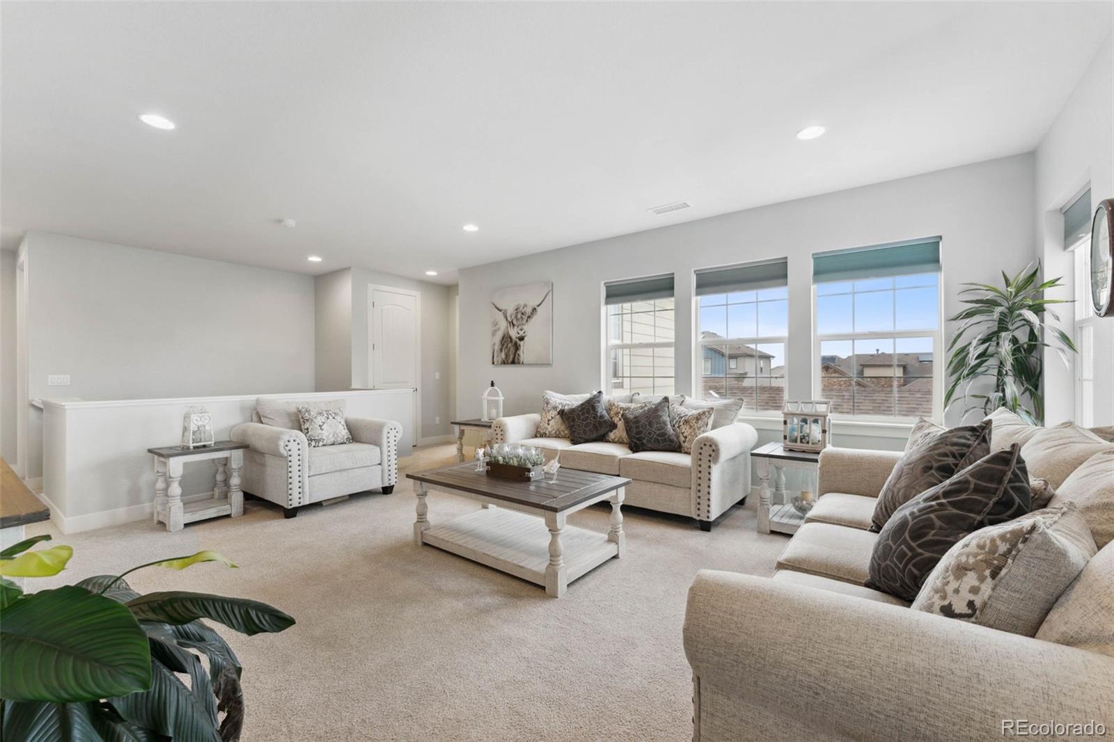 9459 Gore Loop Arvada, CO 80007 - Photo 21 of 50 a living room with furniture and a large window