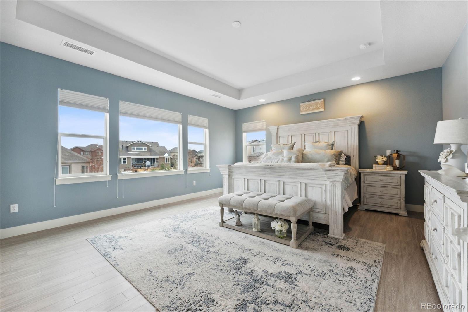 9459 Gore Loop Arvada, CO 80007 - Photo 23 of 50 a bedroom with furniture and a window