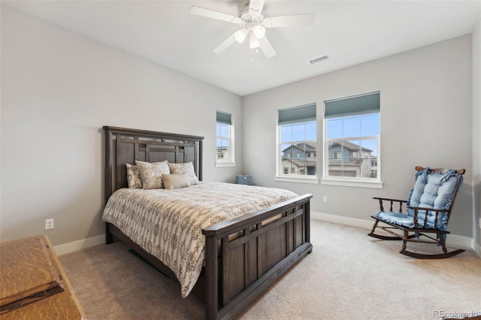 9459 Gore Loop Arvada, CO 80007 - Photo 31 of 50 a bedroom with a bed chair and window