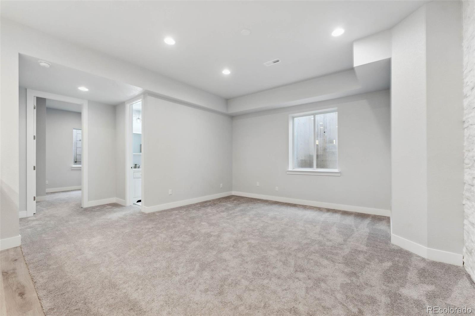 9459 Gore Loop Arvada, CO 80007 - Photo 40 of 50 an empty room with windows and closet