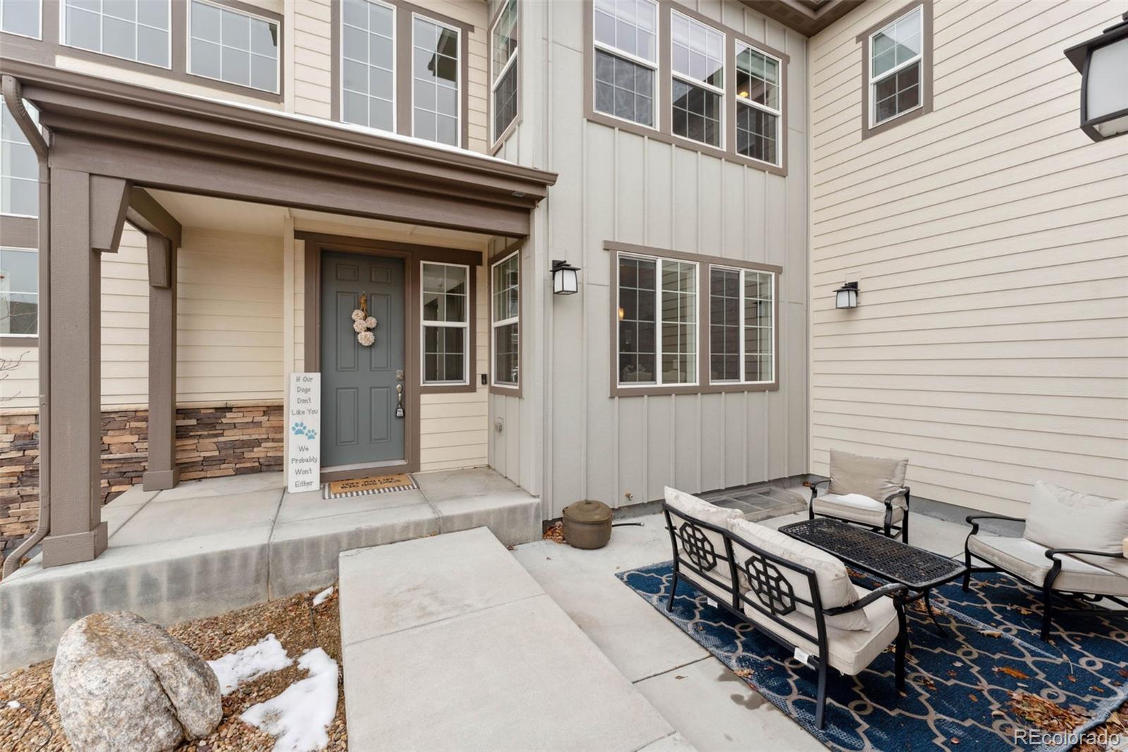 9459 Gore Loop Arvada, CO 80007 - Photo 4 of 50 a backyard of a house with table and chairs