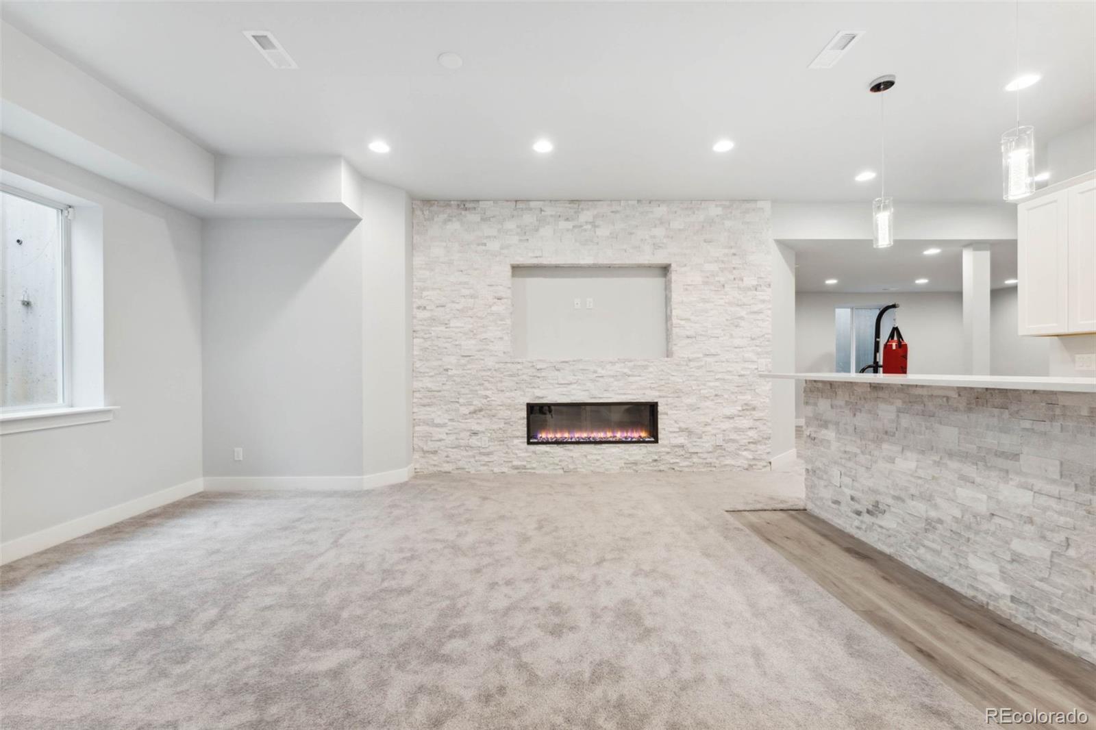 9459 Gore Loop Arvada, CO 80007 - Photo 41 of 50 a view of a hallway with a fireplace