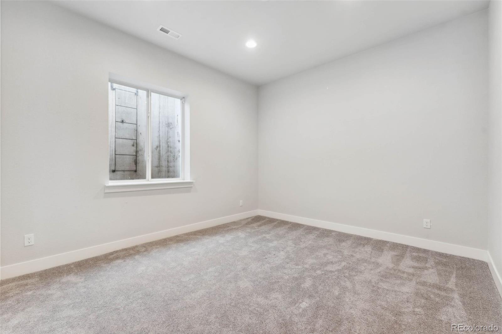 9459 Gore Loop Arvada, CO 80007 - Photo 43 of 50 an empty room with a window