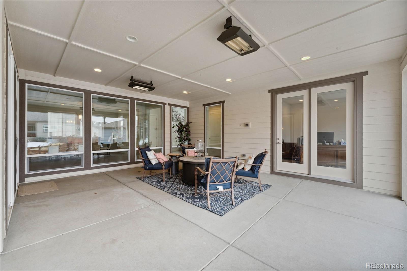 9459 Gore Loop Arvada, CO 80007 - Photo 46 of 50 a view of a dining room with furniture window and outside view