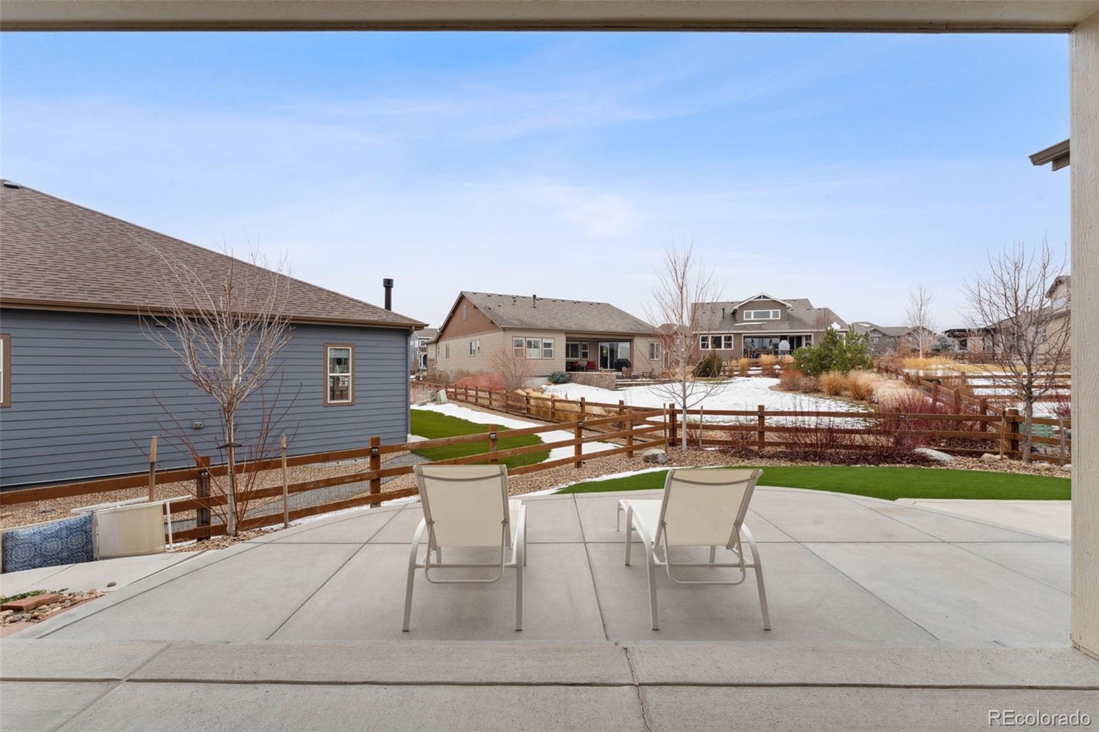 9459 Gore Loop Arvada, CO 80007 - Photo 47 of 50 a view of a patio with a table and chairs