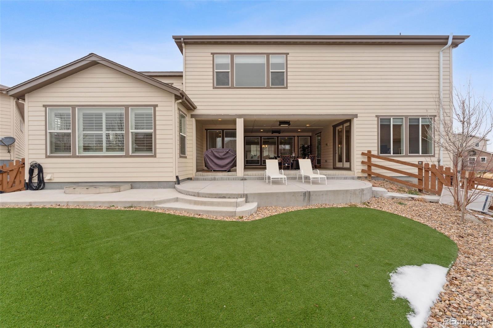 9459 Gore Loop Arvada, CO 80007 - Photo 48 of 50 a view of house with a backyard